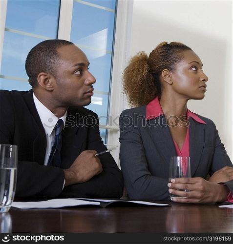Close-up of a businessman and a businesswoman in an office