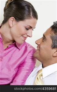 Close-up of a businessman and a businesswoman looking at each other