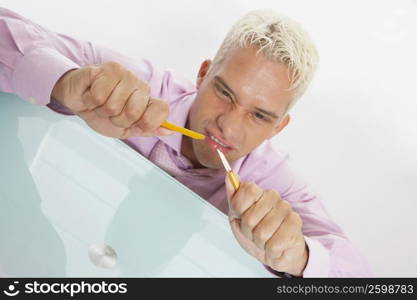 Close-up of a businessman breaking a pencil