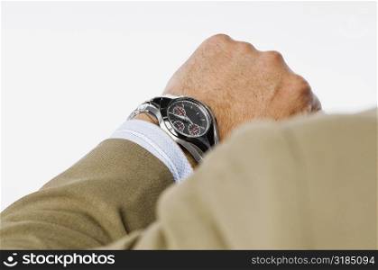 Close-up of a businessman checking the time