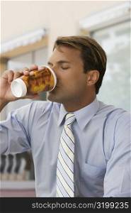 Close-up of a businessman drinking coffee