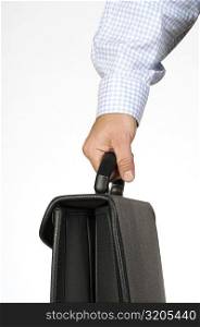 Close-up of a businessman holding a briefcase