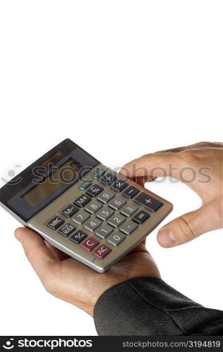 Close-up of a businessman holding a calculator