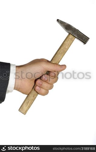 Close-up of a businessman holding a hammer