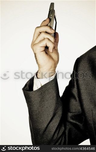 Close-up of a businessman holding a mobile phone