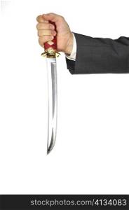 Close-up of a businessman holding a sword