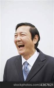 Close-up of a businessman laughing