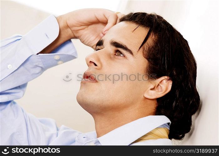 Close-up of a businessman looking up