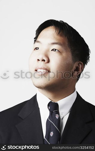 Close-up of a businessman looking up smiling