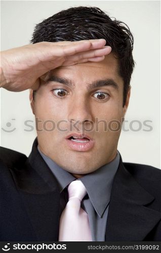 Close-up of a businessman saluting