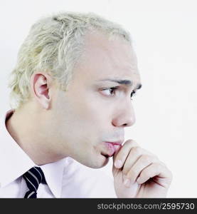 Close-up of a businessman sucking his thumb