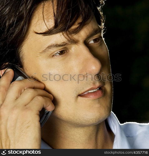 Close-up of a businessman talking on a mobile phone