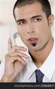 Close-up of a businessman talking on the telephone