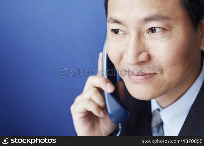 Close-up of a businessman talking on the telephone