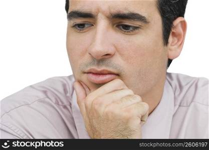 Close-up of a businessman thinking with his hand on his chin