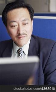 Close-up of a businessman using a computer