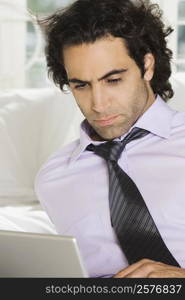 Close-up of a businessman using a laptop