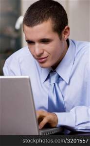 Close-up of a businessman using a laptop