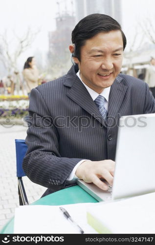 Close-up of a businessman using a laptop