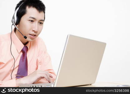 Close-up of a businessman using a laptop