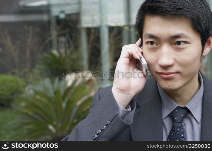 Close-up of a businessman using a mobile phone