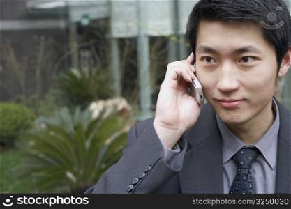 Close-up of a businessman using a mobile phone