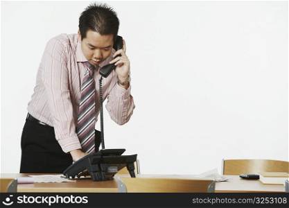 Close-up of a businessman using the telephone