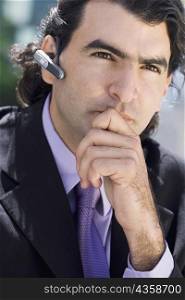 Close-up of a businessman wearing a hands free device