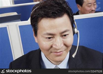 Close-up of a businessman wearing headsets