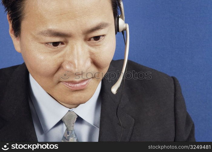 Close-up of a businessman wearing headsets