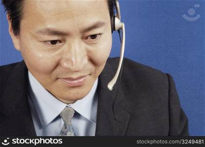 Close-up of a businessman wearing headsets