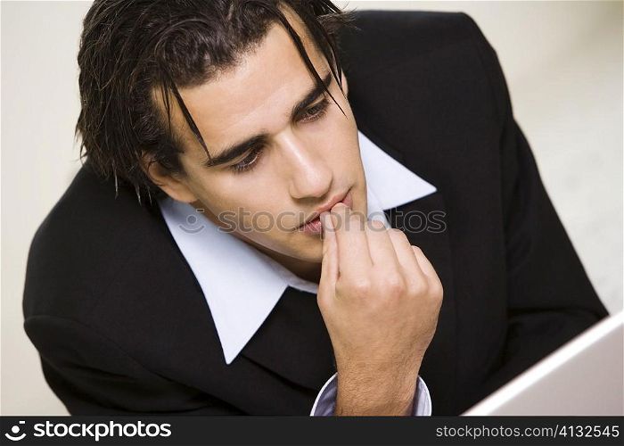 Close-up of a businessman with his finger on his lips
