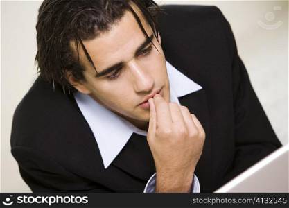 Close-up of a businessman with his finger on his lips