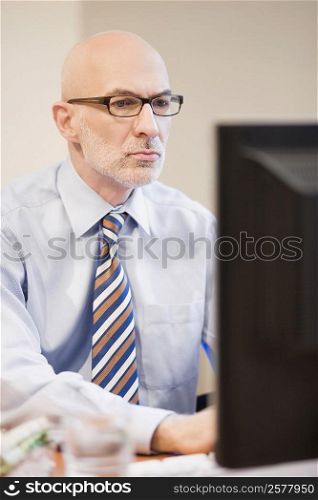 Close-up of a businessman working on a computer