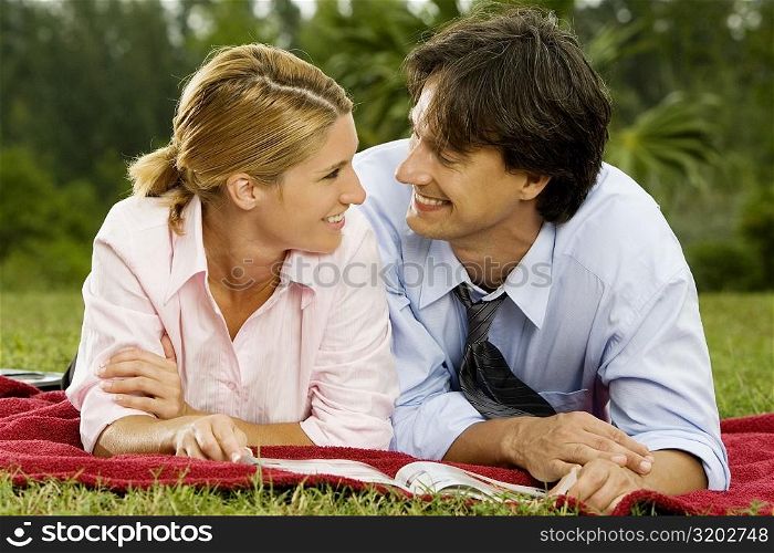 Close-up of a businesswoman and a businessman looking at each other