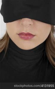 Close-up of a businesswoman blindfolded