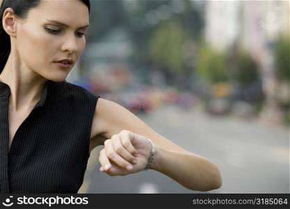Close-up of a businesswoman checking the time