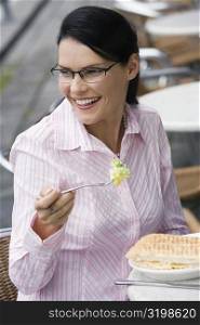 Close-up of a businesswoman having a lunch at a sidewalk cafe