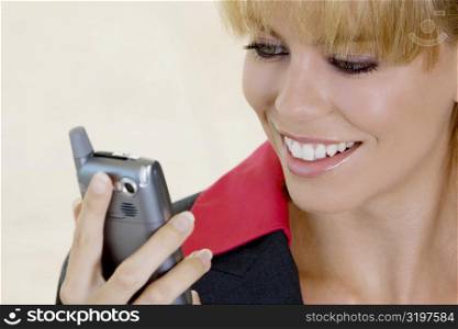 Close-up of a businesswoman looking at mobile phone