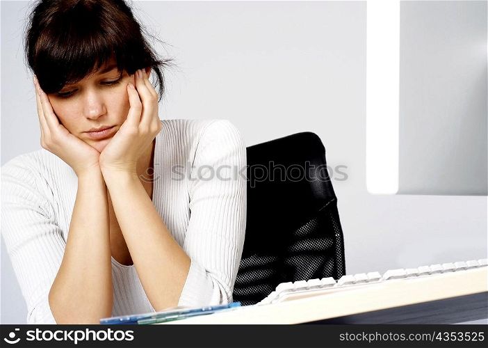 Close-up of a businesswoman looking depressed