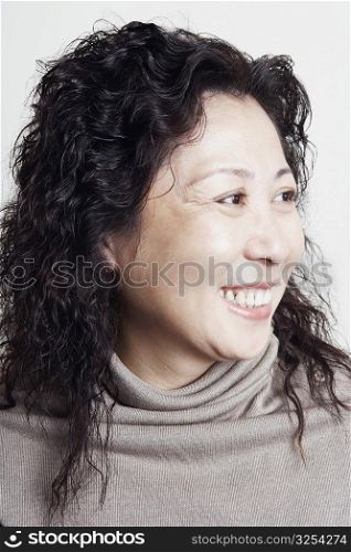 Close-up of a businesswoman looking sideways smiling