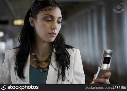 Close-up of a businesswoman operating a mobile phone