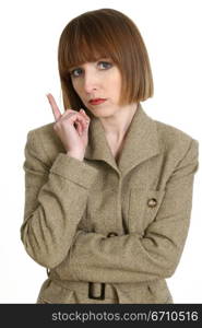 Close-up of a businesswoman pointing upward