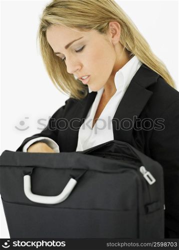 Close-up of a businesswoman searching in her bag