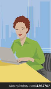 Close-up of a businesswoman sitting in an office and using a laptop