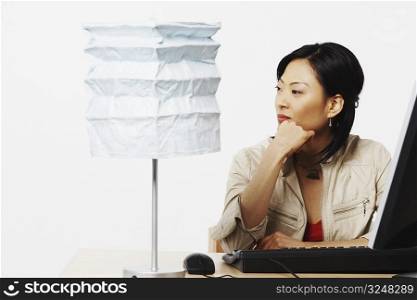 Close-up of a businesswoman sitting in front of a computer