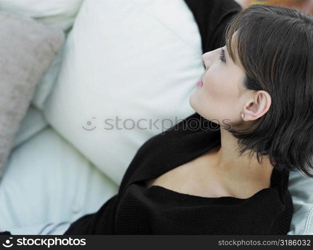 Close-up of a businesswoman sitting on a couch