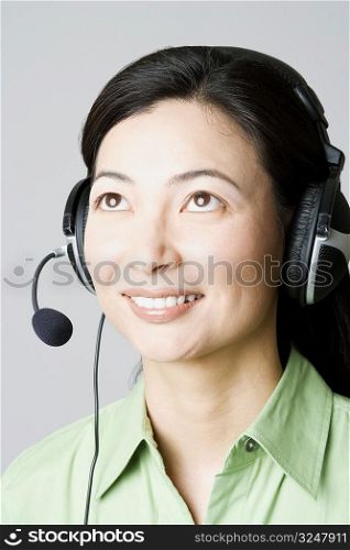 Close-up of a businesswoman smiling with a headset