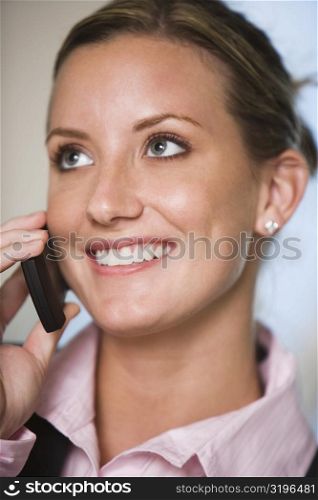 Close-up of a businesswoman talking on a mobile phone