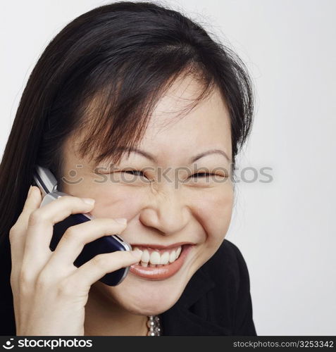 Close-up of a businesswoman talking on a mobile phone